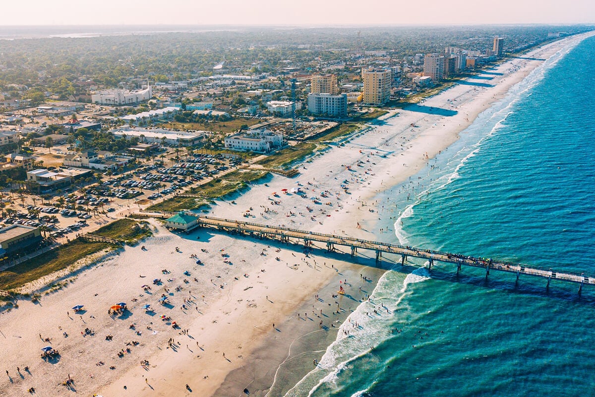 Aerial view of Jacksonville Beach, its oceanfront homes, and the Atlantic shoreline